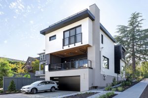 High-performance Madison Park home exterior with durable siding and protective detailing designed for long-term performance in a wet coastal environment.