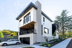 Exterior view of a Madison Park Passive House showing modern panel cladding, Shou Sugi Ban siding, and a high-performance zero-energy envelope.