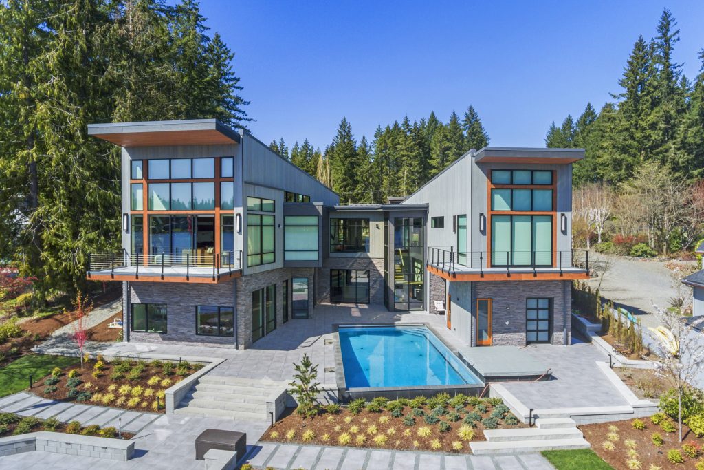 Modern new-build residence with Equitone fiber-cement panels, Hardie board-and-batten siding, and clear cedar accents installed by Synapse Construction as part of a full building envelope package in Black Diamond, WA.