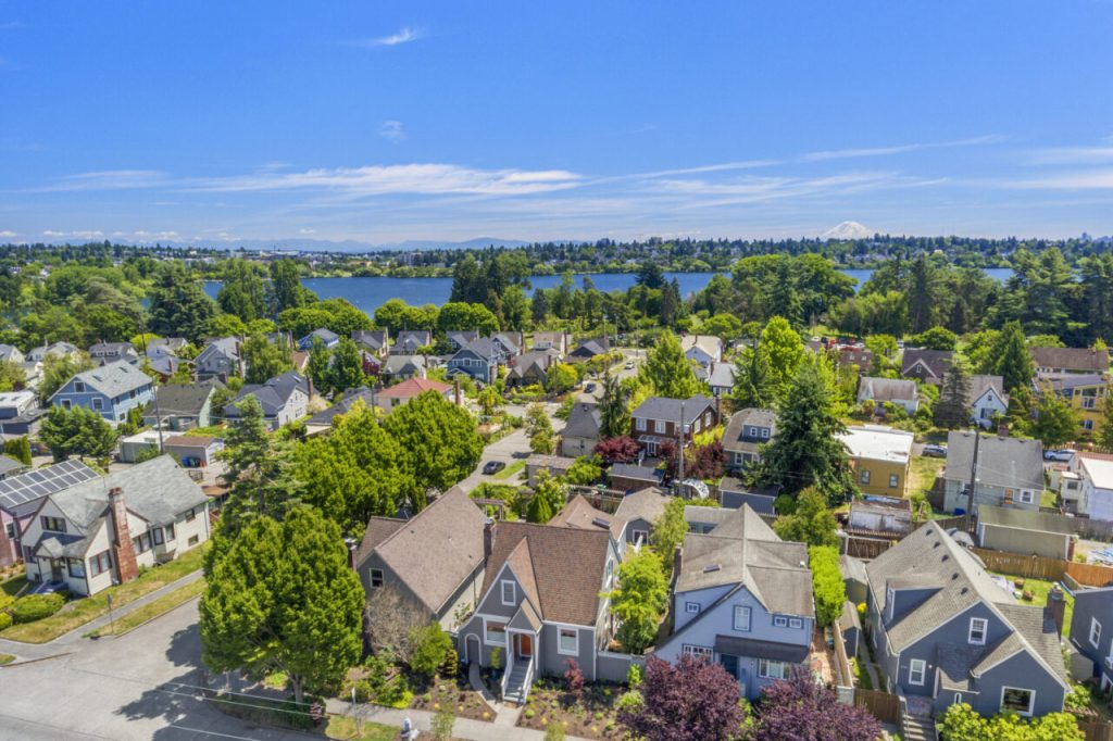 Aerial view of Green Lake Seattle neighborhood highlighting a fully reclad home and ADU with new siding, deck, and exterior improvements near Green Lake.