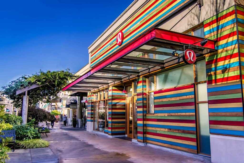Colorful commercial retail façade featuring custom exterior cladding and building envelope detailing by Synapse Construction in Seattle.