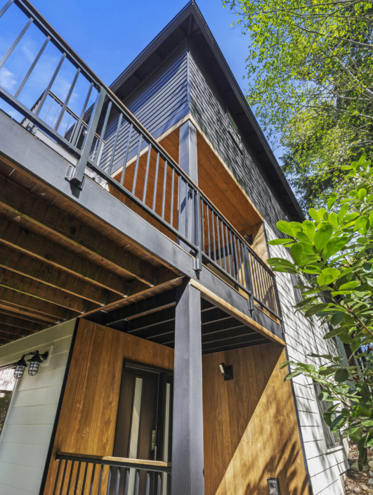 Underside of elevated deck showing structural framing and waterproofing protection above occupied space, a critical area for deck membrane performance in the Pacific Northwest.