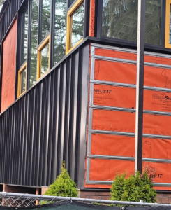 Alt Text (SEO + Accessibility Optimized)Weather-resistive barrier installed behind modern exterior cladding, showing moisture protection layers on a Seattle-area building.